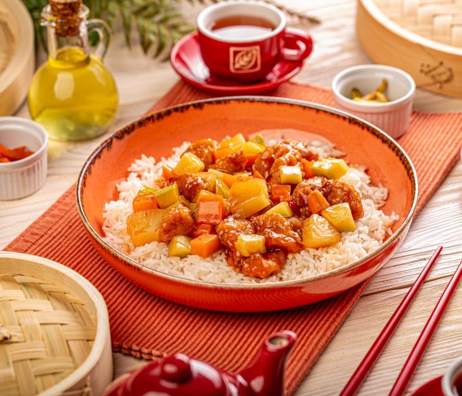 Pineapple and chicken in sweet and sour sauce. Traditional Chinese food